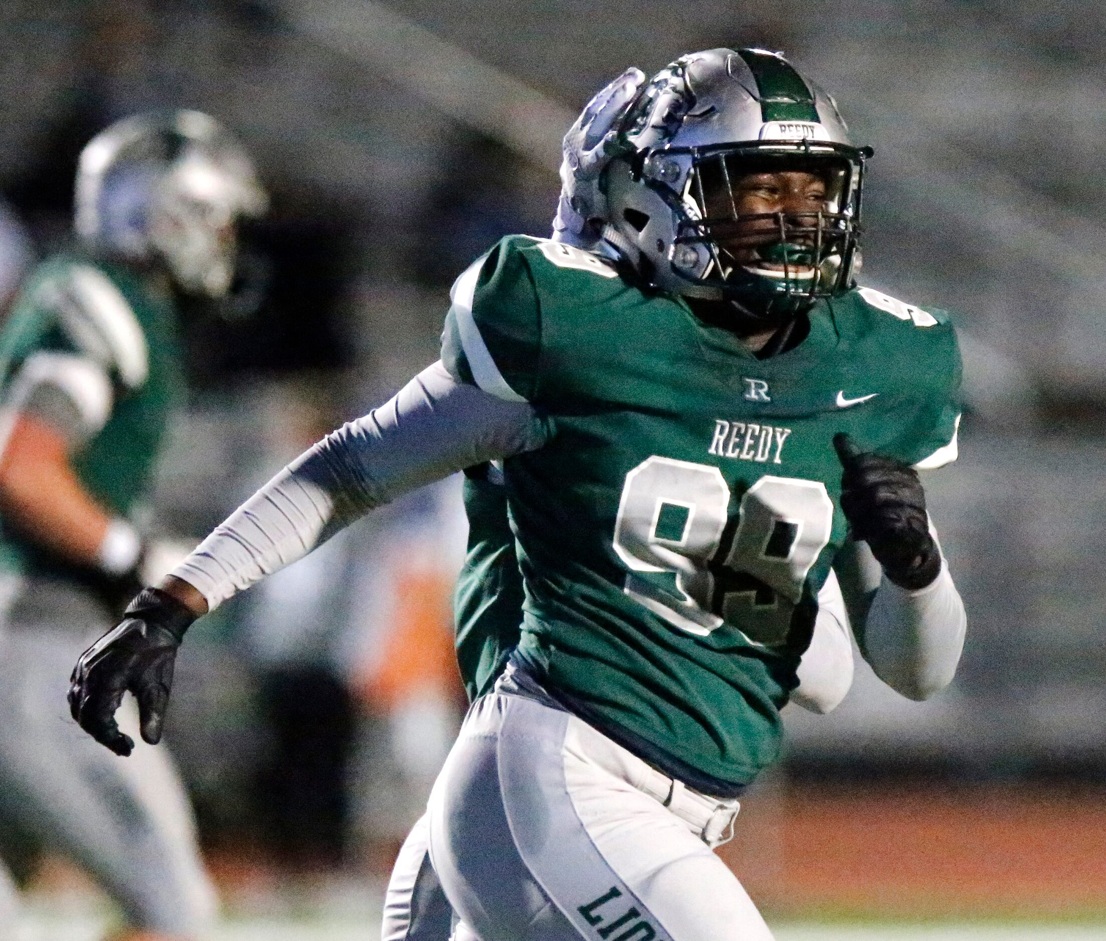 Frisco Reedy High School defensive tackle Joseph Duffey (99) is all smiles after making an...