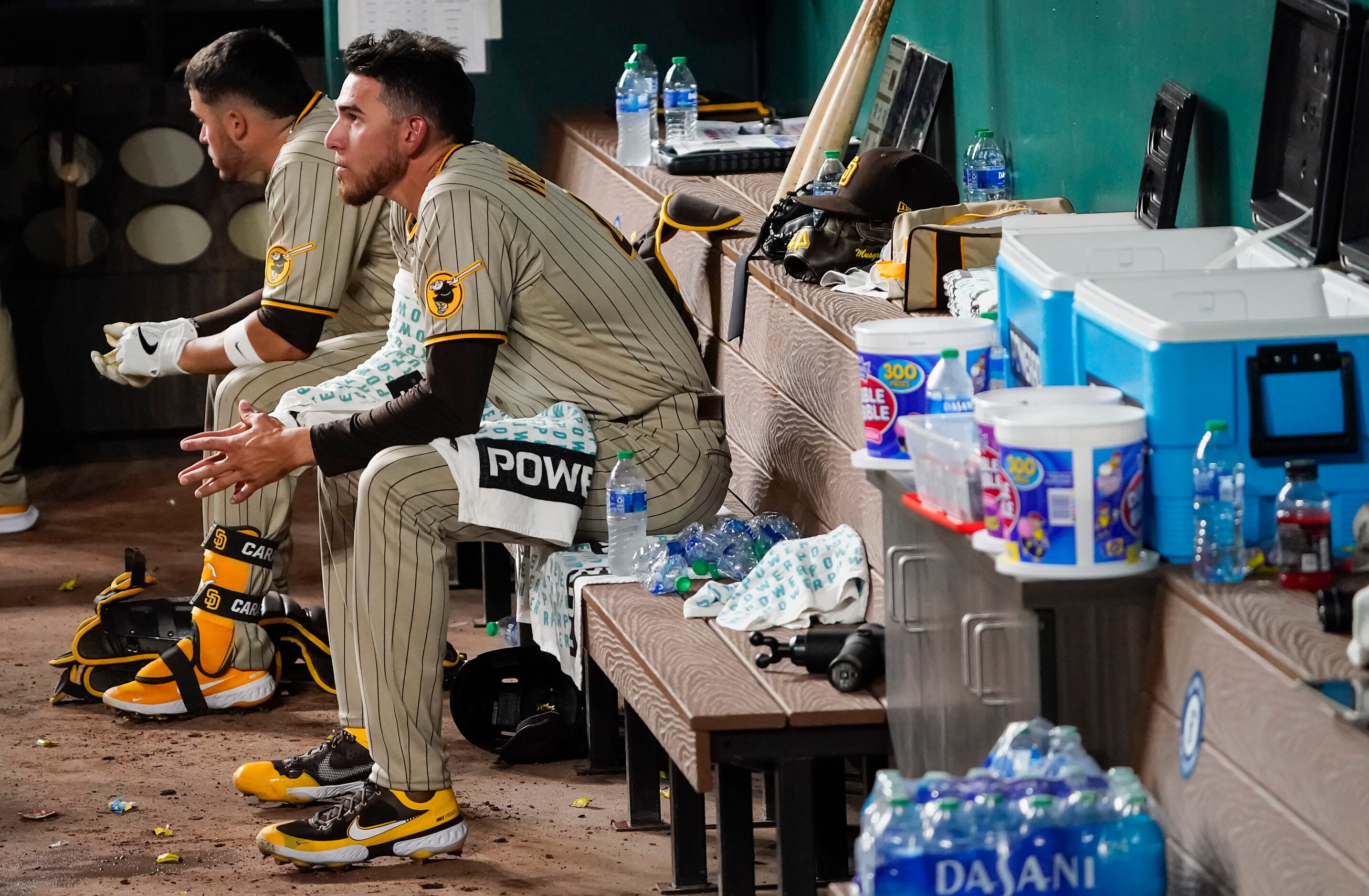 San Diego Padres starting pitcher Joe Musgrove watches from the dugout as his team hits...