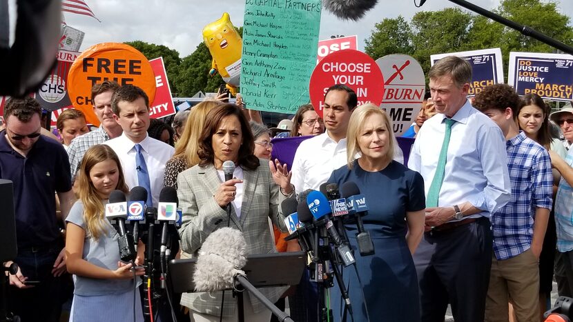 Sen. Kamala Harris speaks to news media outside the migrant detention center in Homestead,...