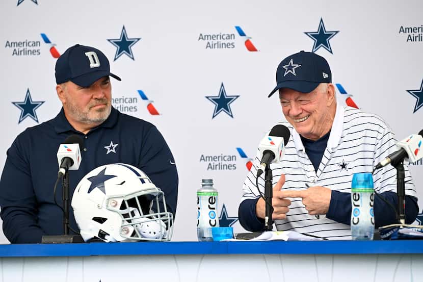 Dallas Cowboys head coach Mike McCarthy, left and owner Jerry Jones, right, react as they...