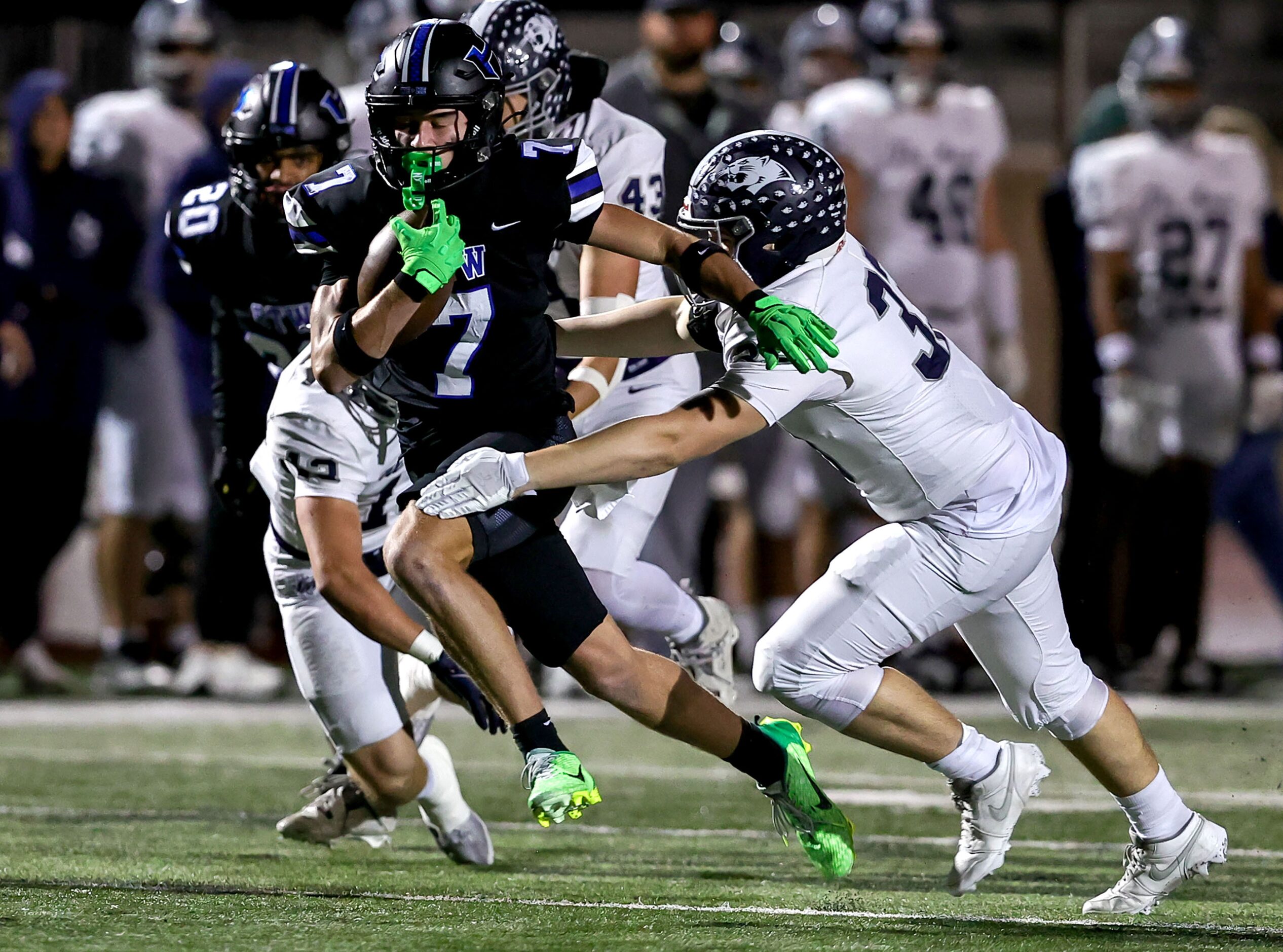 Hebron wide receiver Tyler Hoke (7) tries to break free from Flower Mound linebacker Chase...