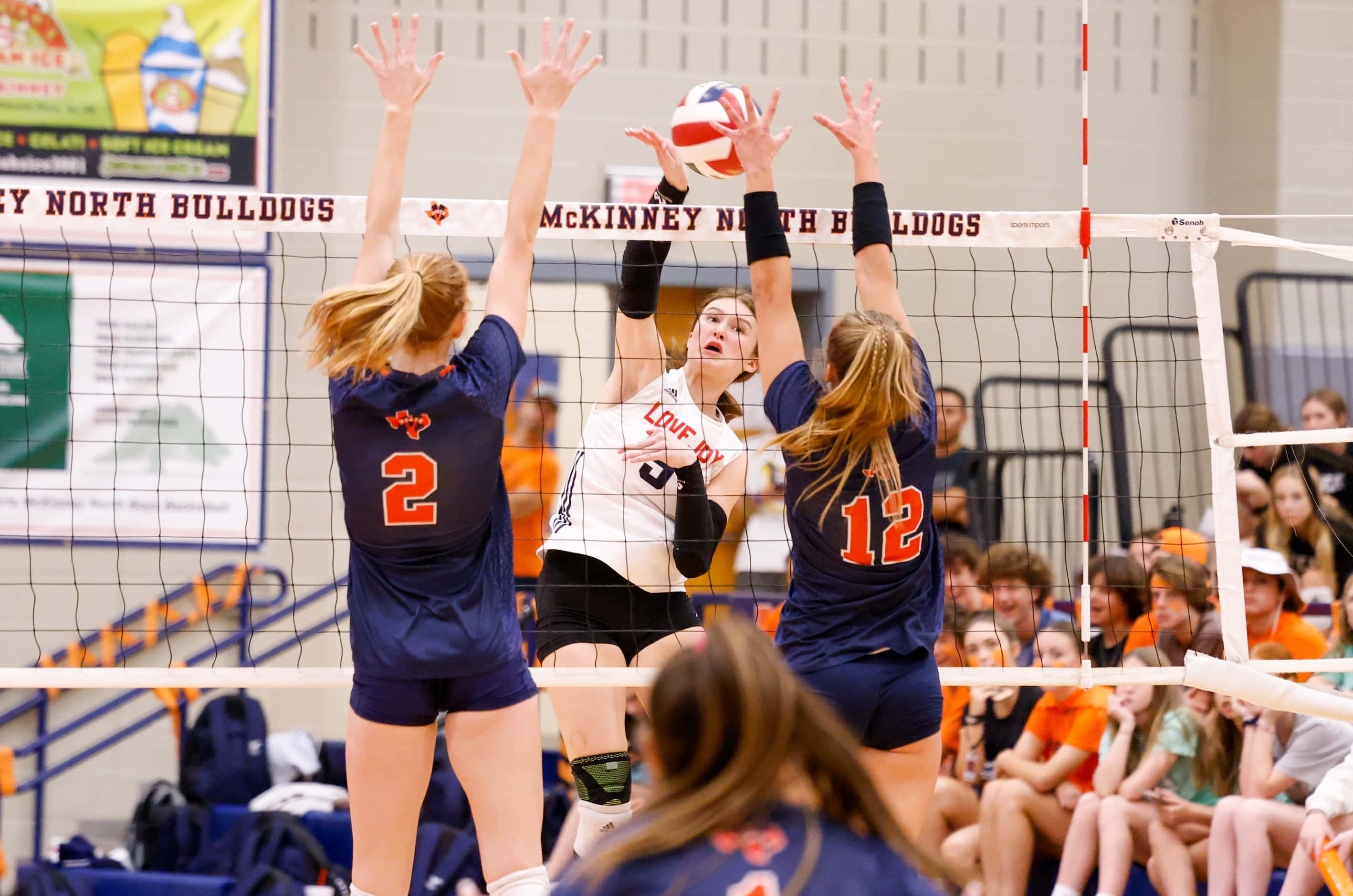 Lovejoy Morgan VanVoorhis (5) spikes the ball for a point against McKinney North at a match...