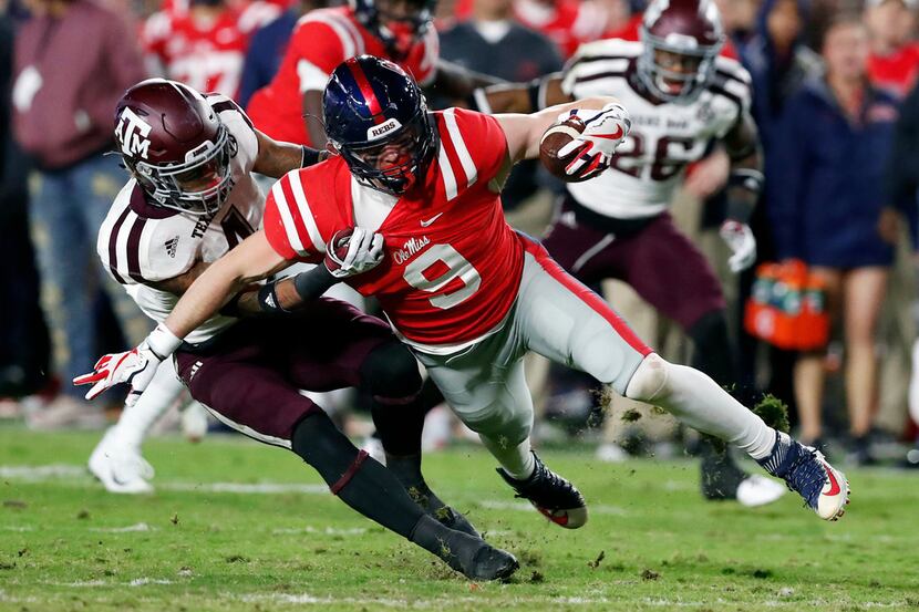 Mississippi wide receiver Tre Nixon (4) is tackled by Texas A&M defensive back Derrick...