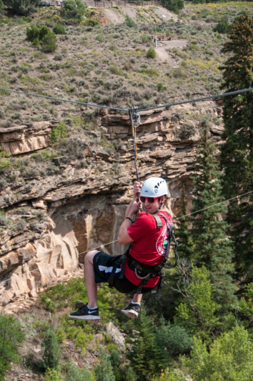 A guest zips across the canyon outside Vail, Colorado.  Runs here reach 20-story heights and...