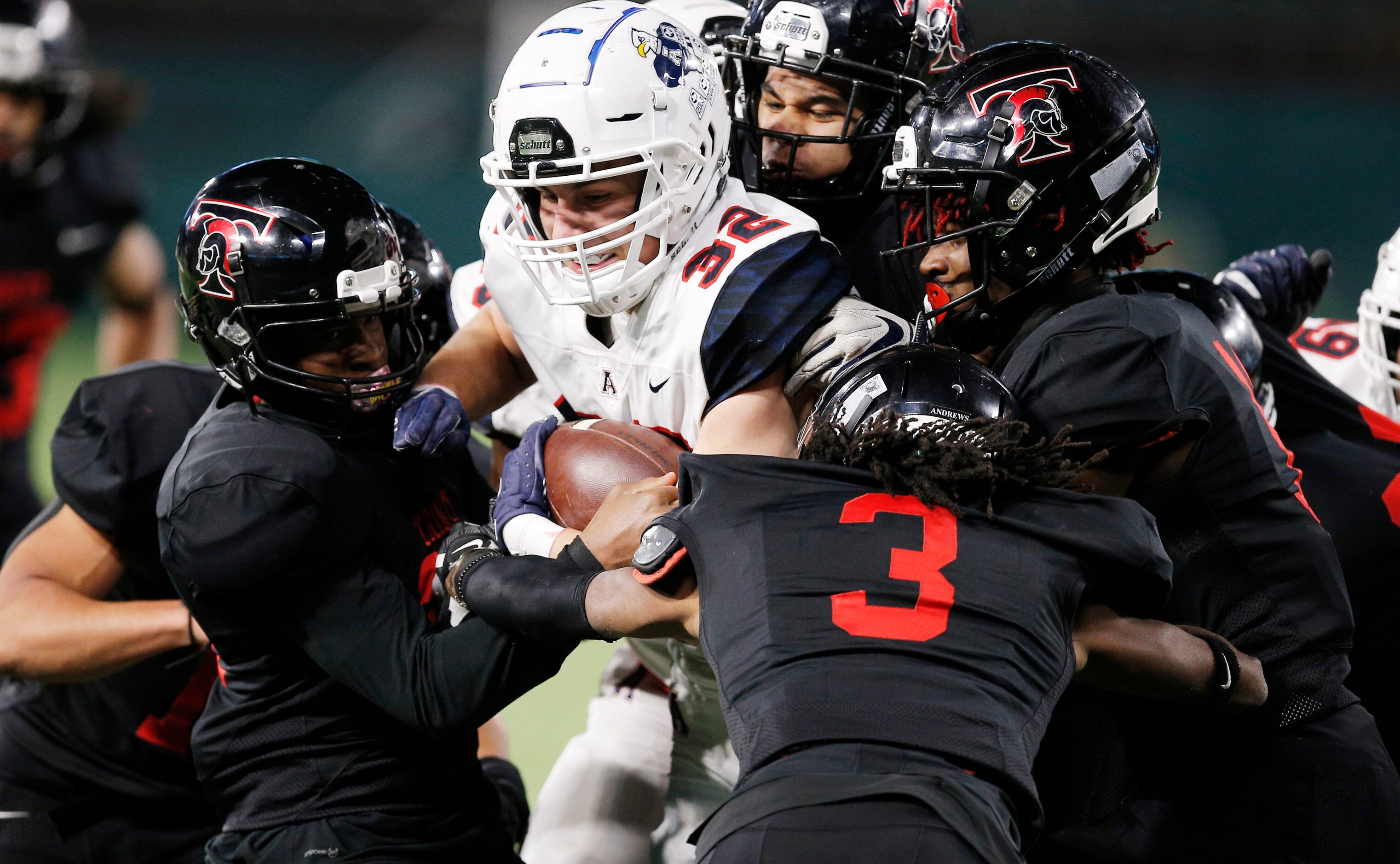 Allen senior wide receiver Carson McKay (32) battles for yardage against Euless Trinity...