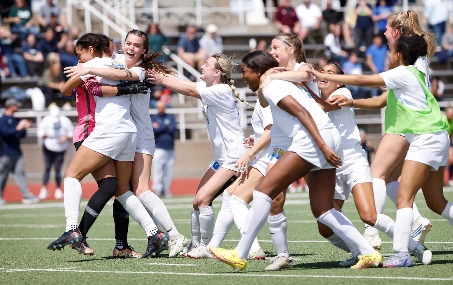 Teammates mob Frisco goalkeeper Ariana Anderson  (left) after a shootout to defeat Frisco...