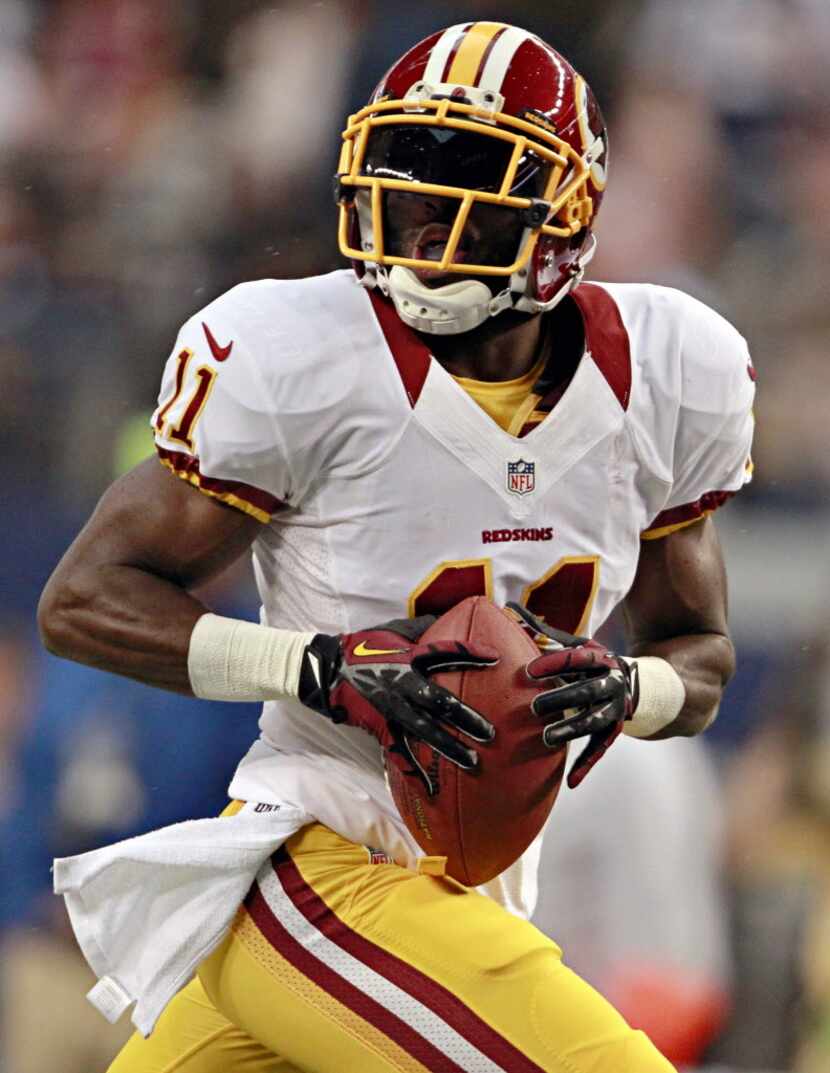 Washington Redskins wide receiver Aldrick Robinson runs for a 68-yard touchdown during the...