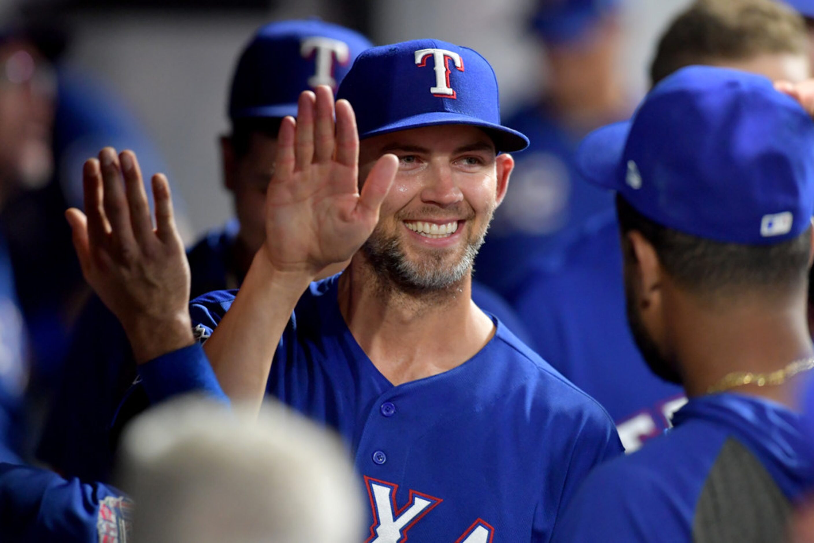 CLEVELAND, OHIO - AUGUST 05: Starting pitcher Mike Minor #23 of the Texas Rangers celebrates...