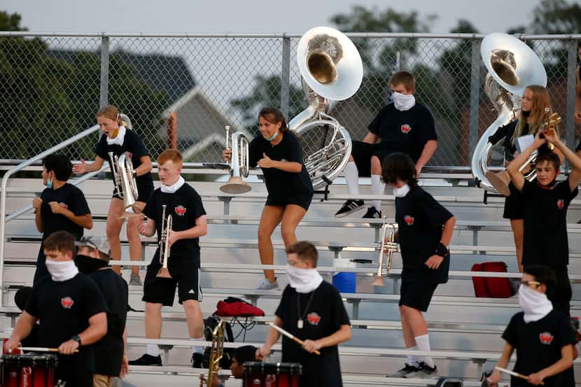 The Argyle band plays while being social-distanced, during a high school football game...