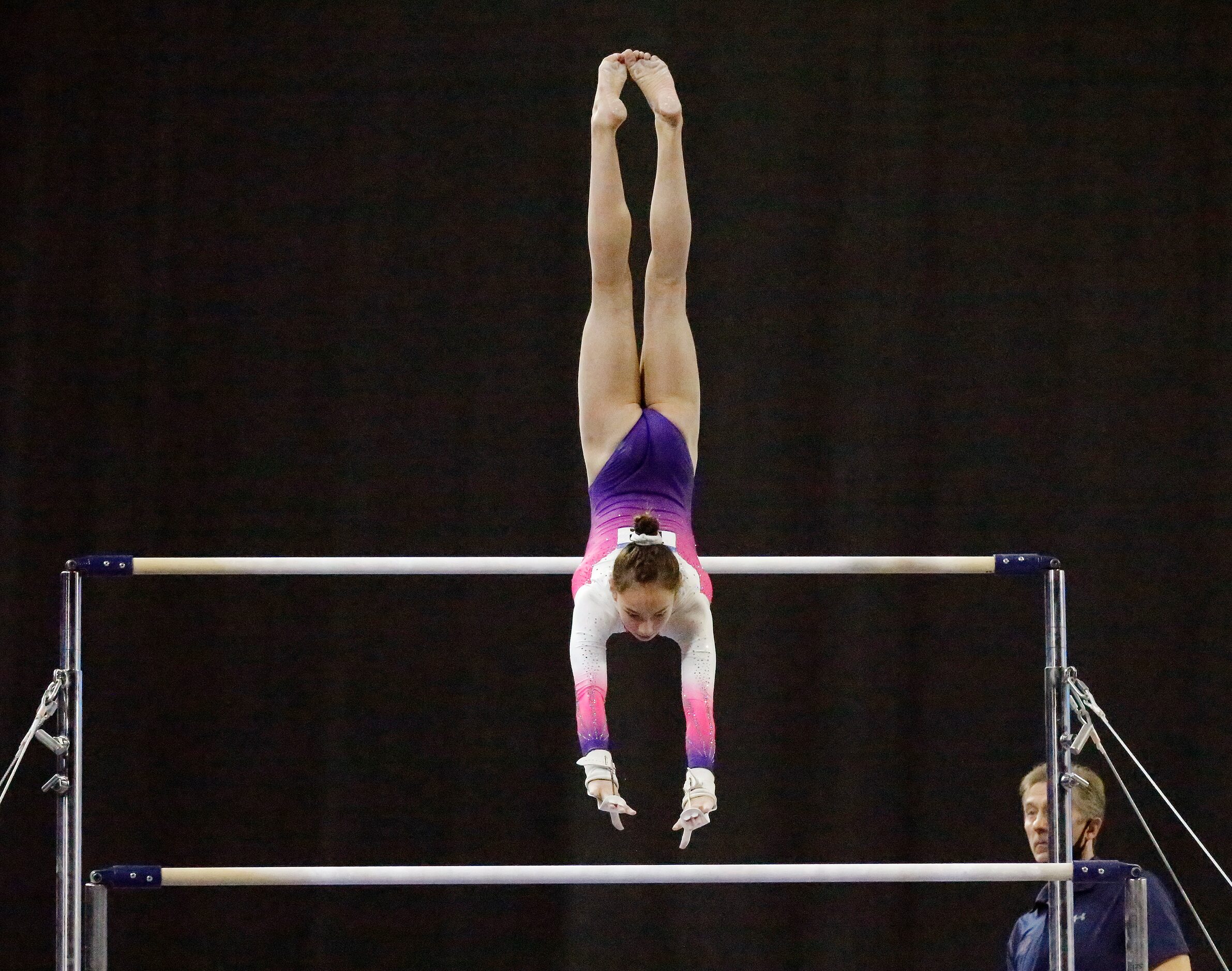 Brooke Pierson with WOGA Gymnastics in Plano, performs on the uneven bars during the USA...