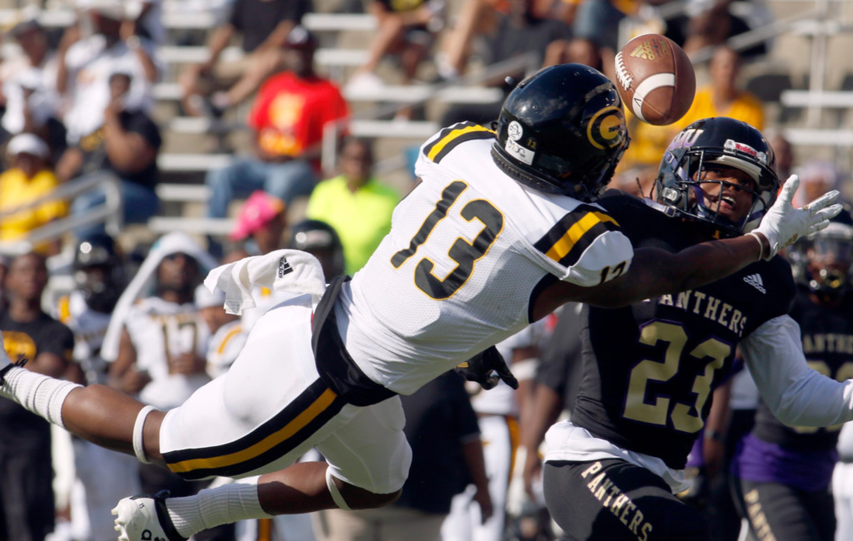 Gambling State receiver Quintin Guice (13) makes a diving attempt but is unable to make the...