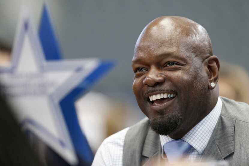 Former Dallas Cowboys player Emmitt Smith laughs as fellow teammate Michael Irvin talks...