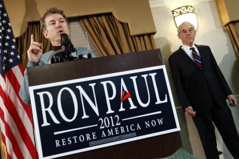 Sen. Rand Paul, R-Ky., introduces his father, U.S. Rep Ron Paul in Davenport, Iowa.