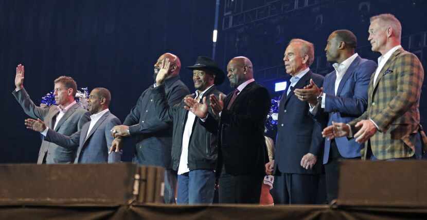 Former Cowboys players are introduced at the United Way fundraiser event at AT&T Stadium in...
