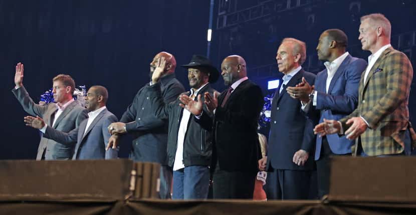 Former Cowboys players are introduced at the United Way fundraiser event at AT&T Stadium in...
