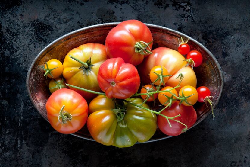 An assortment of fresh, home grown, vine ripened heirloom tomatoes