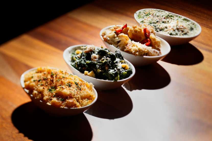 
Four side dishes (from left:): mac and cheese; roasted rapini; roasted cauliflower with...
