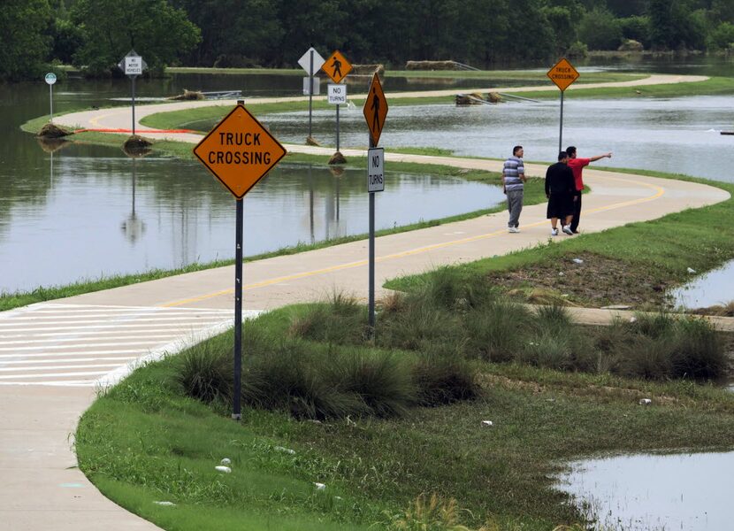 Pedestrians walk part of the Santa Fe Trestle Trail in south Dallas.