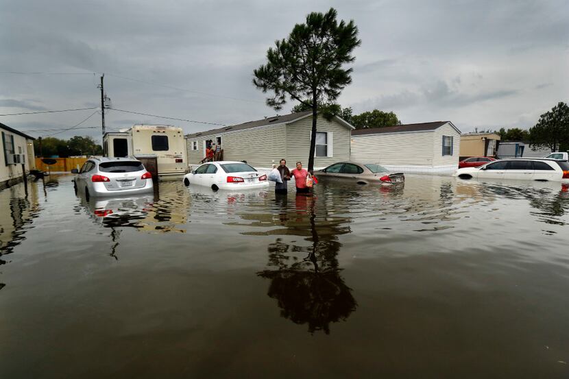 Two days after Hurricane Harvey slammed the Texas cost, residents of the Houston suburb of...
