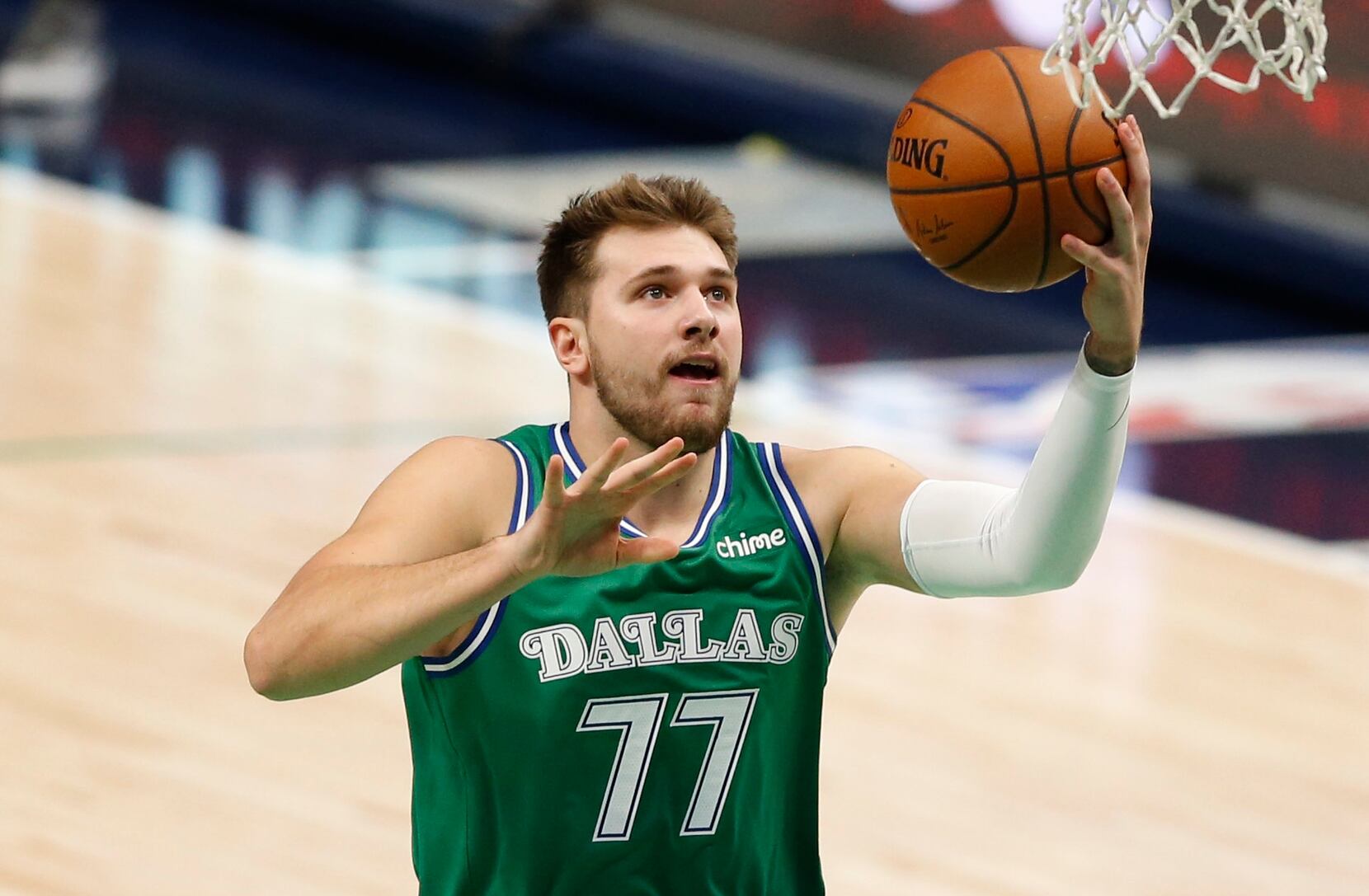 Why does Luka Doncic wear the No.77 jersey for the Dallas Mavericks?