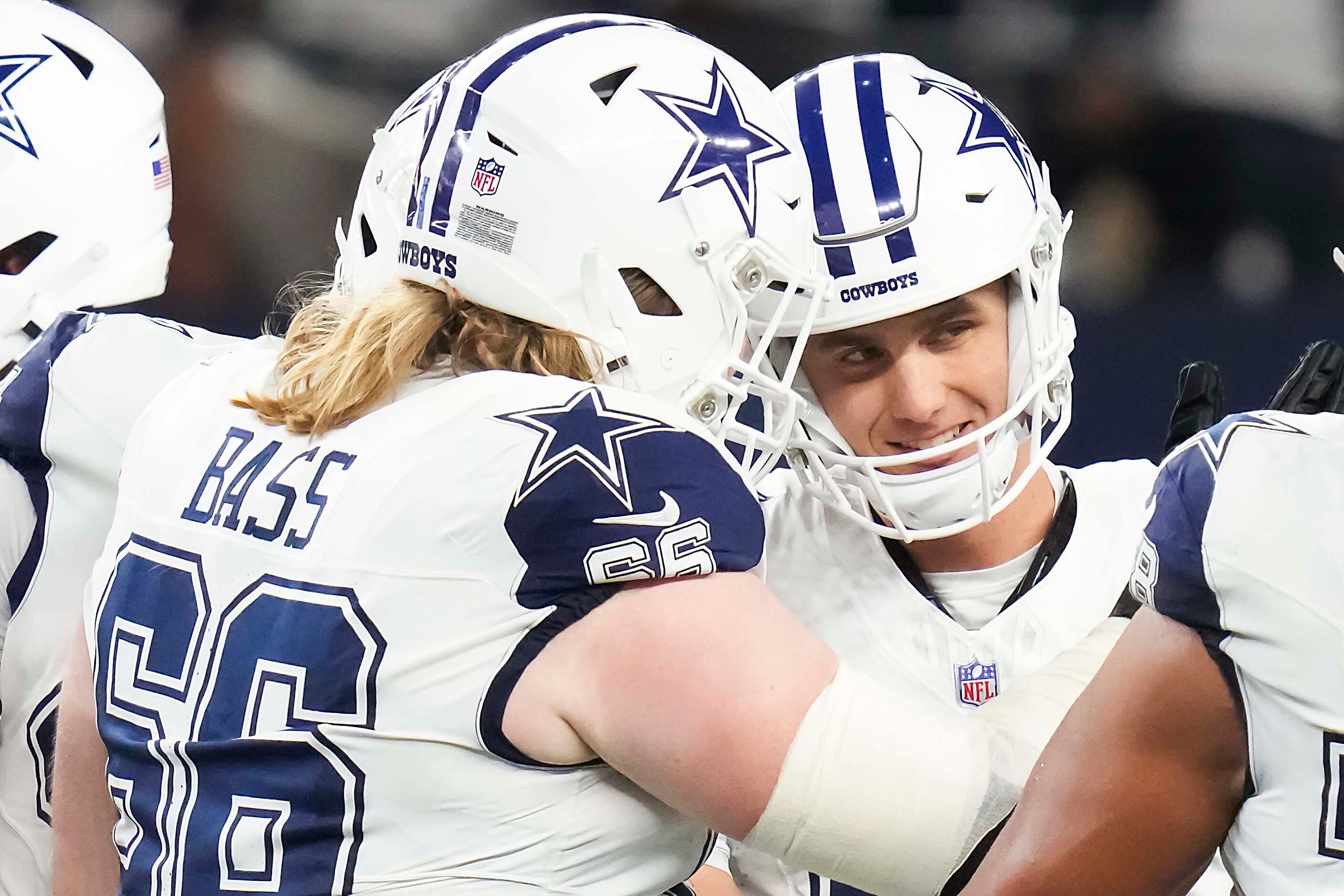 Dallas Cowboys place kicker Brandon Aubrey celebrates with guard T.J. Bass (66) after...