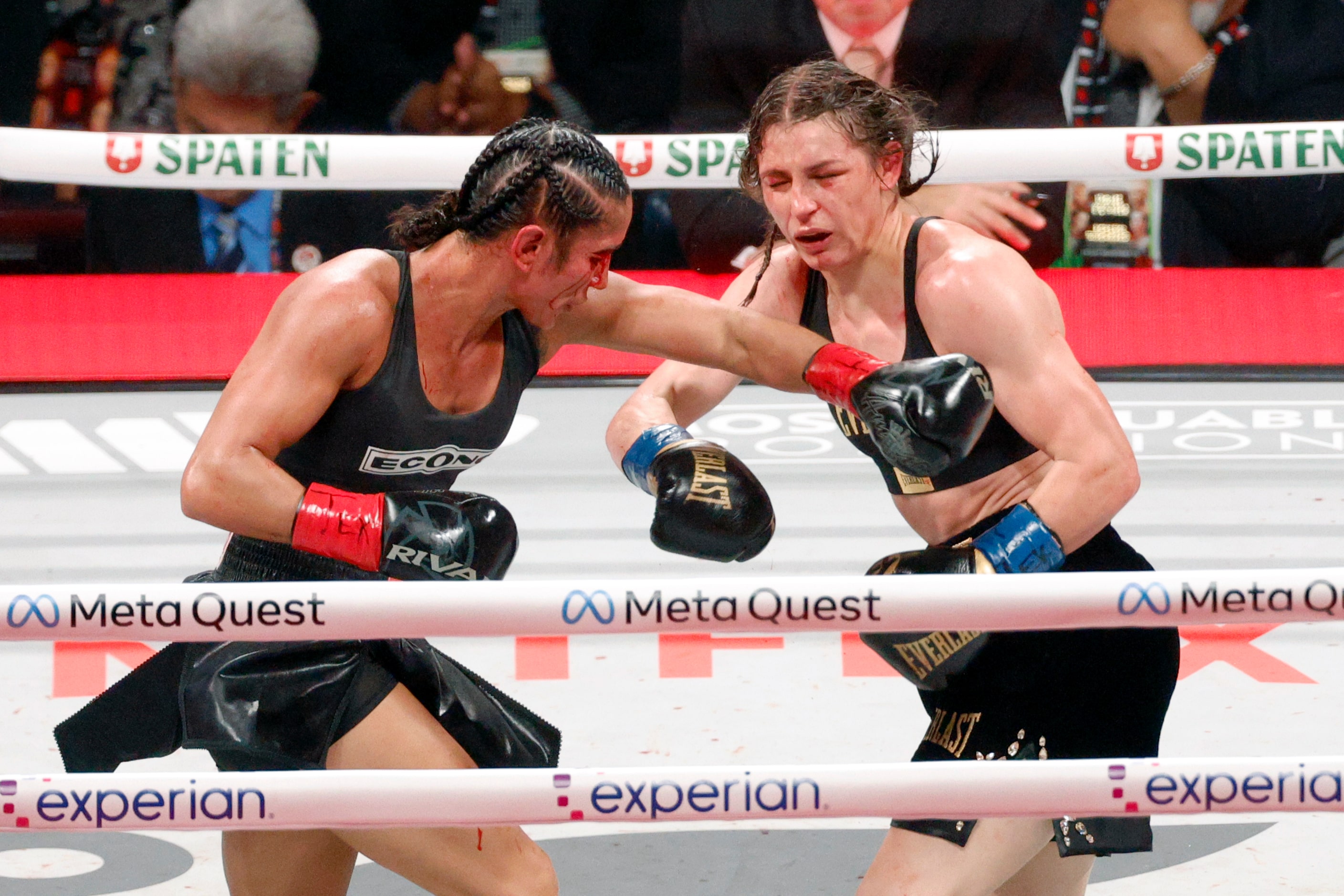 Amanda Serrano (left) and Katie Taylor trade punches during round 10 of the undisputed super...