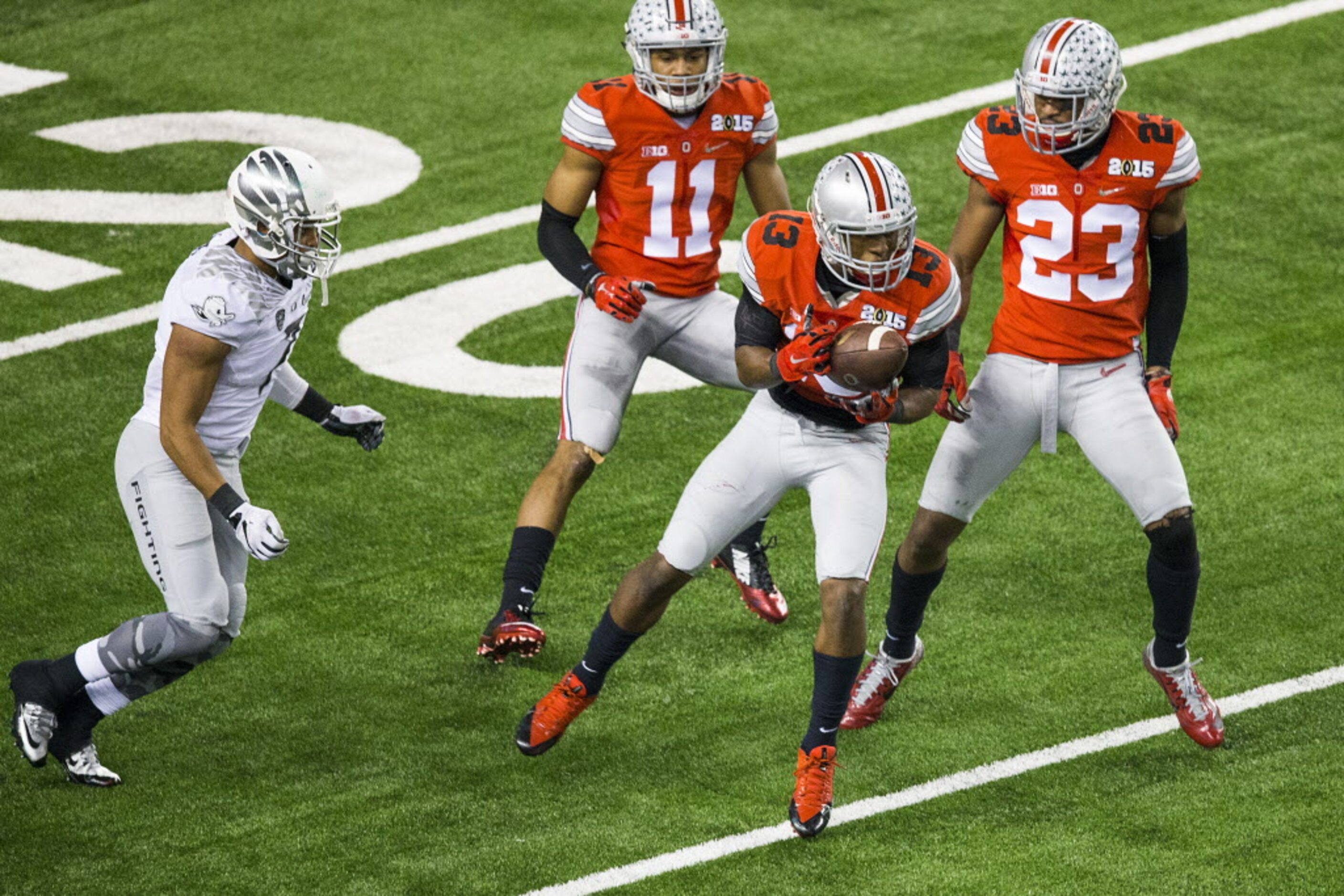 Ohio State Buckeyes cornerback Eli Apple (13) intercepts a pass intended for Oregon Ducks...