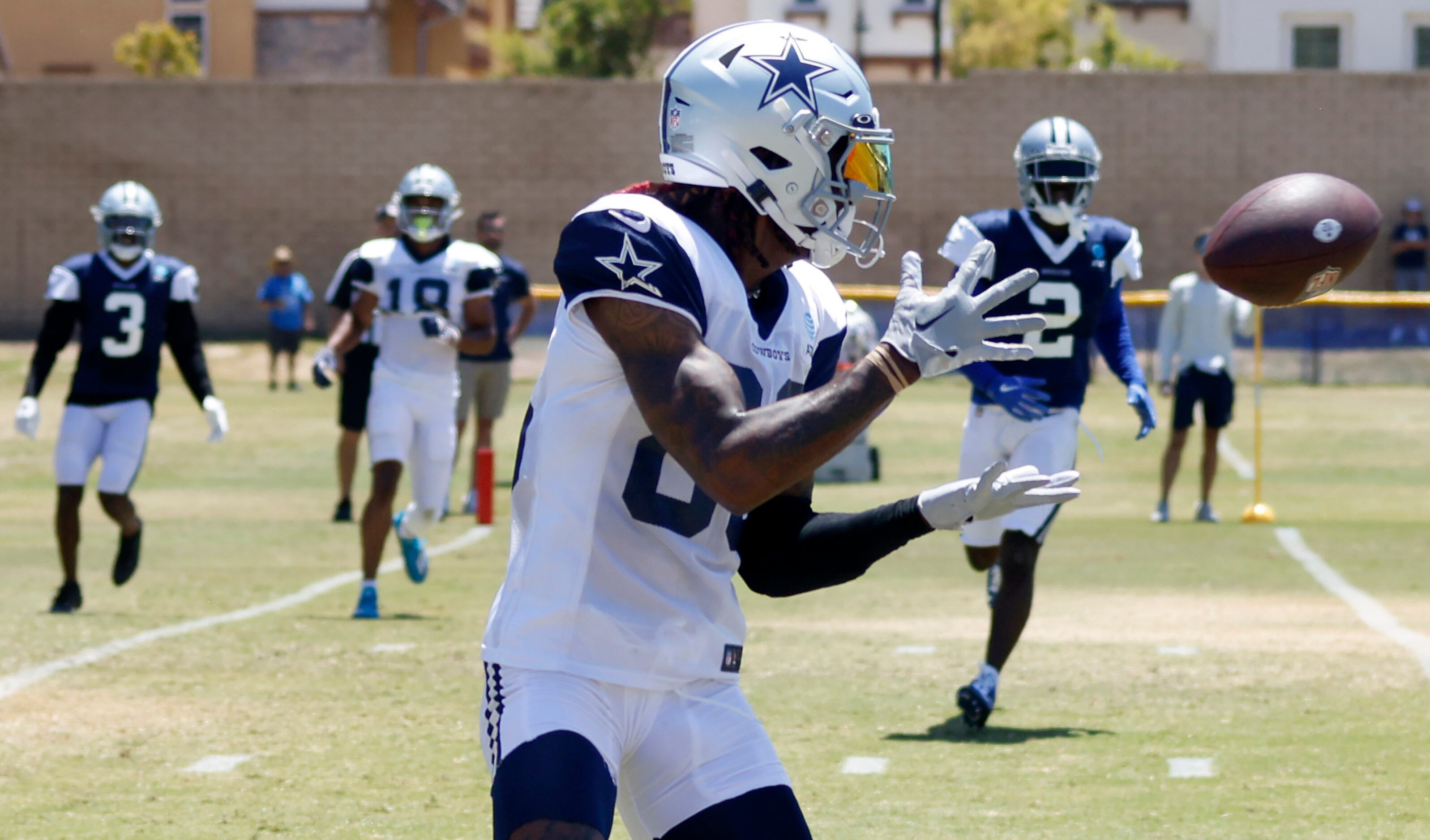 Dallas Cowboys wide receiver CeeDee Lamb (88) makes a pass completion during training camp...