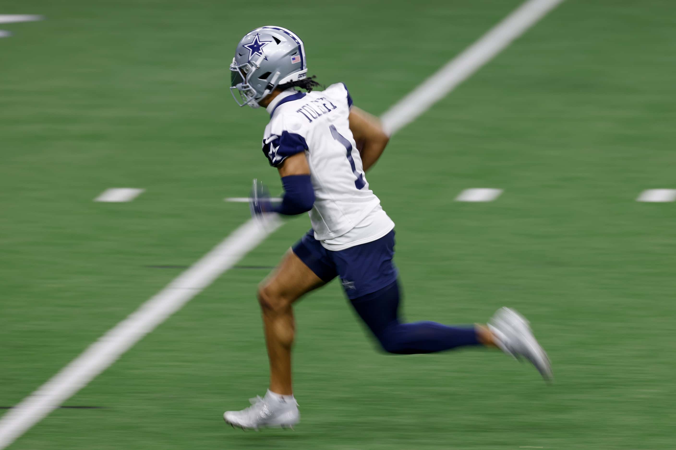 Dallas Cowboys wide receiver Jalen Tolbert (1) runs after a catch during the team's OTA...