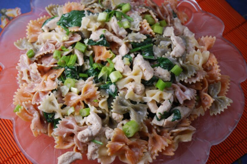 Tricolored pasta brightens up a simple dish made with chicken, spinach and chevre.