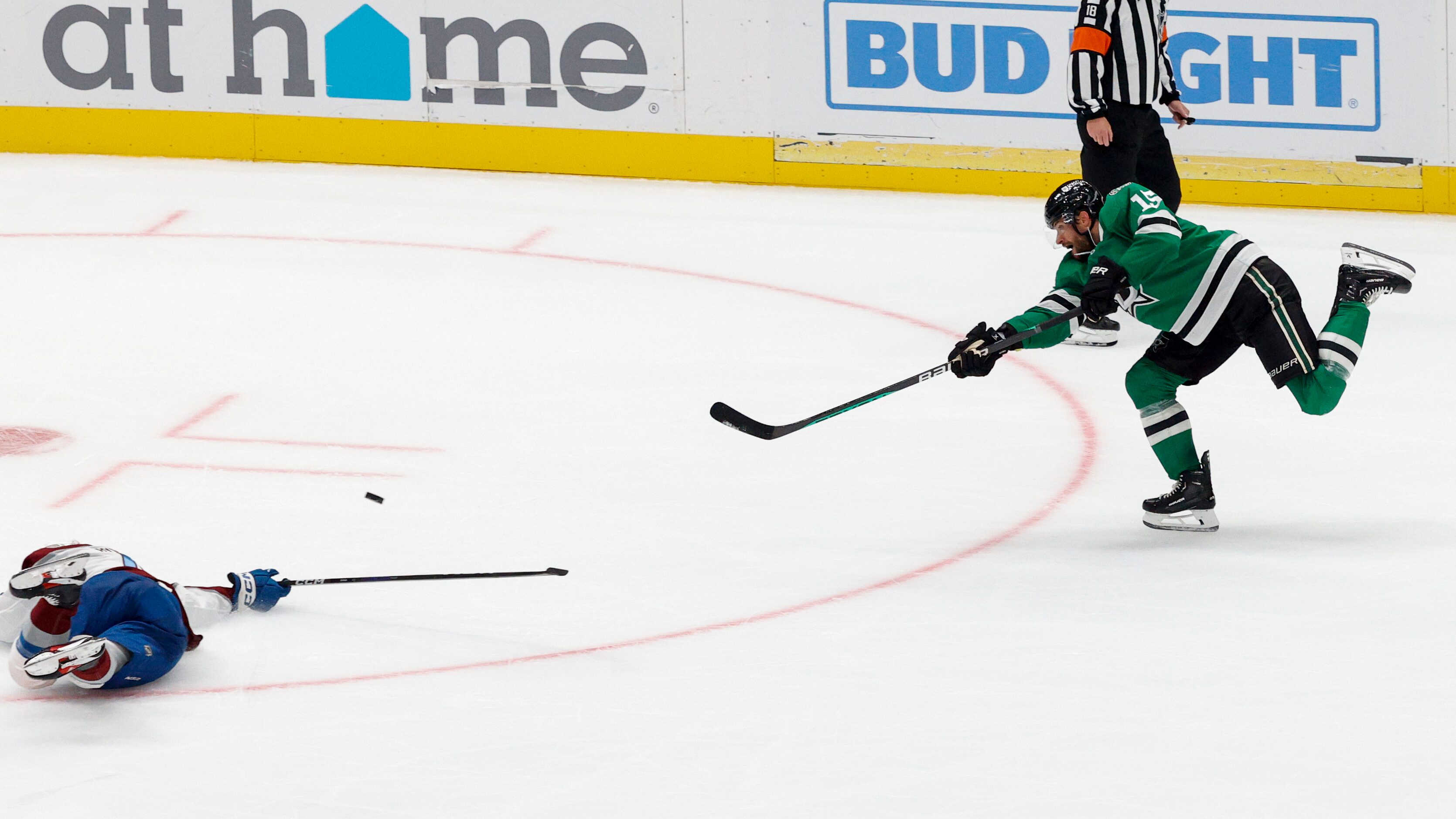 Dallas Stars center Craig Smith (15) scores an empty net goal ahead of a diving Colorado...