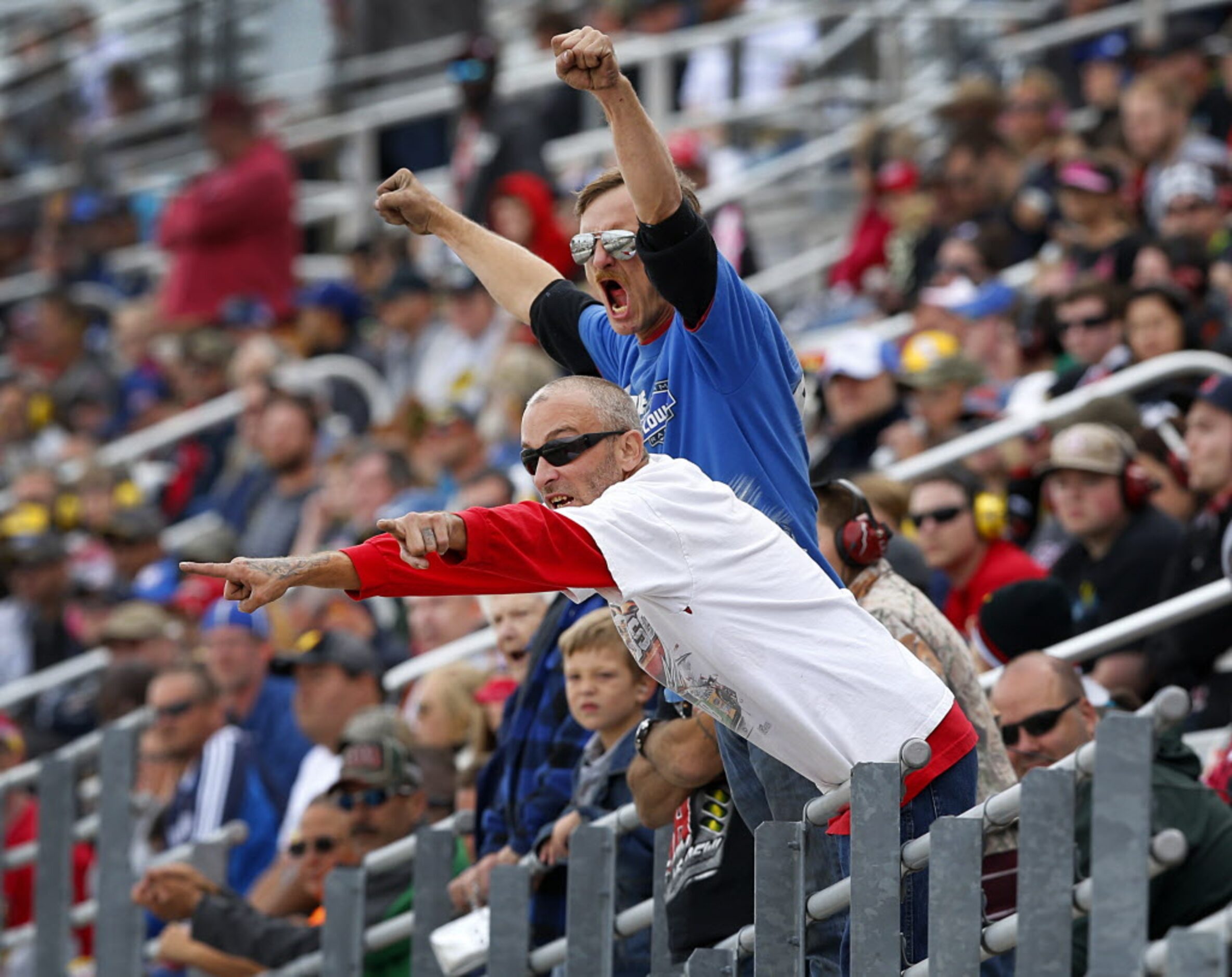 Racing fans cheers their drivers in the AAA Texas 500 at the Texas Motor Speedway in Fort...