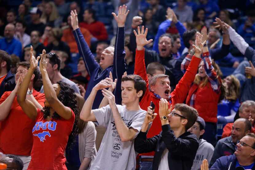 SMU fans cheer after an alley-oop during an NCAA college basketball game against Tulsa in...