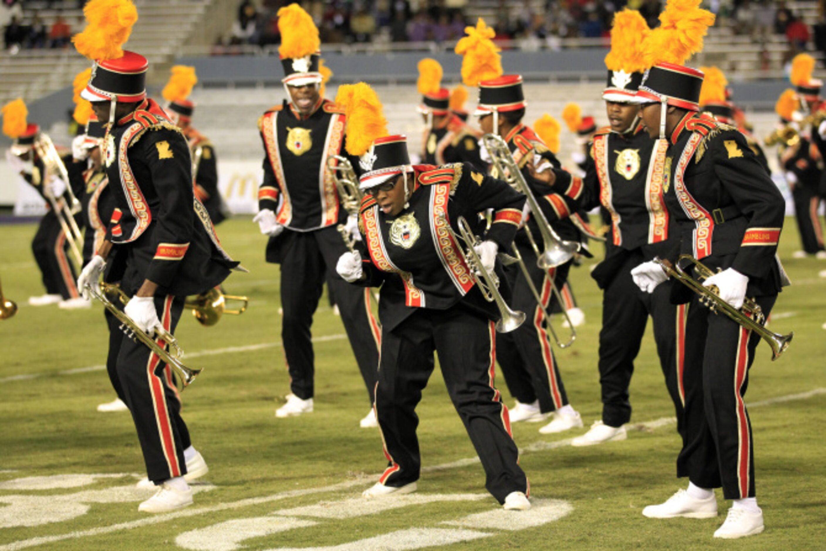 Members of the Grambling band dance during the halftime show of a NCAA football game between...