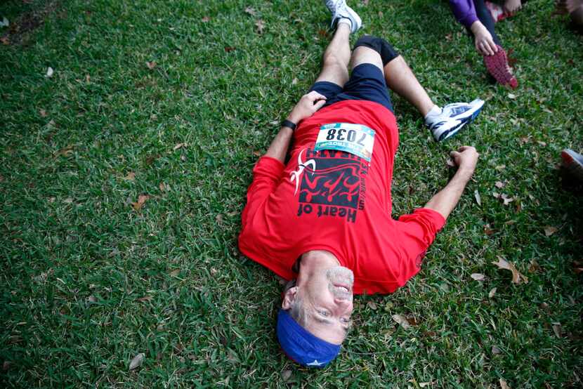 David Smith of Rockwall stretches before the Dallas YMCA Turkey Trot in downtown Dallas on...