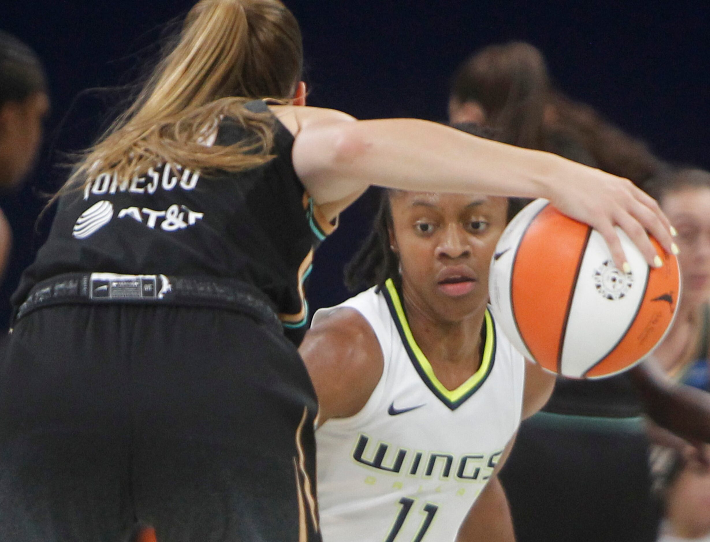 Dallas Wings guard Crystal Dangerfield (11) defends against New York Liberty guard Sabrina...