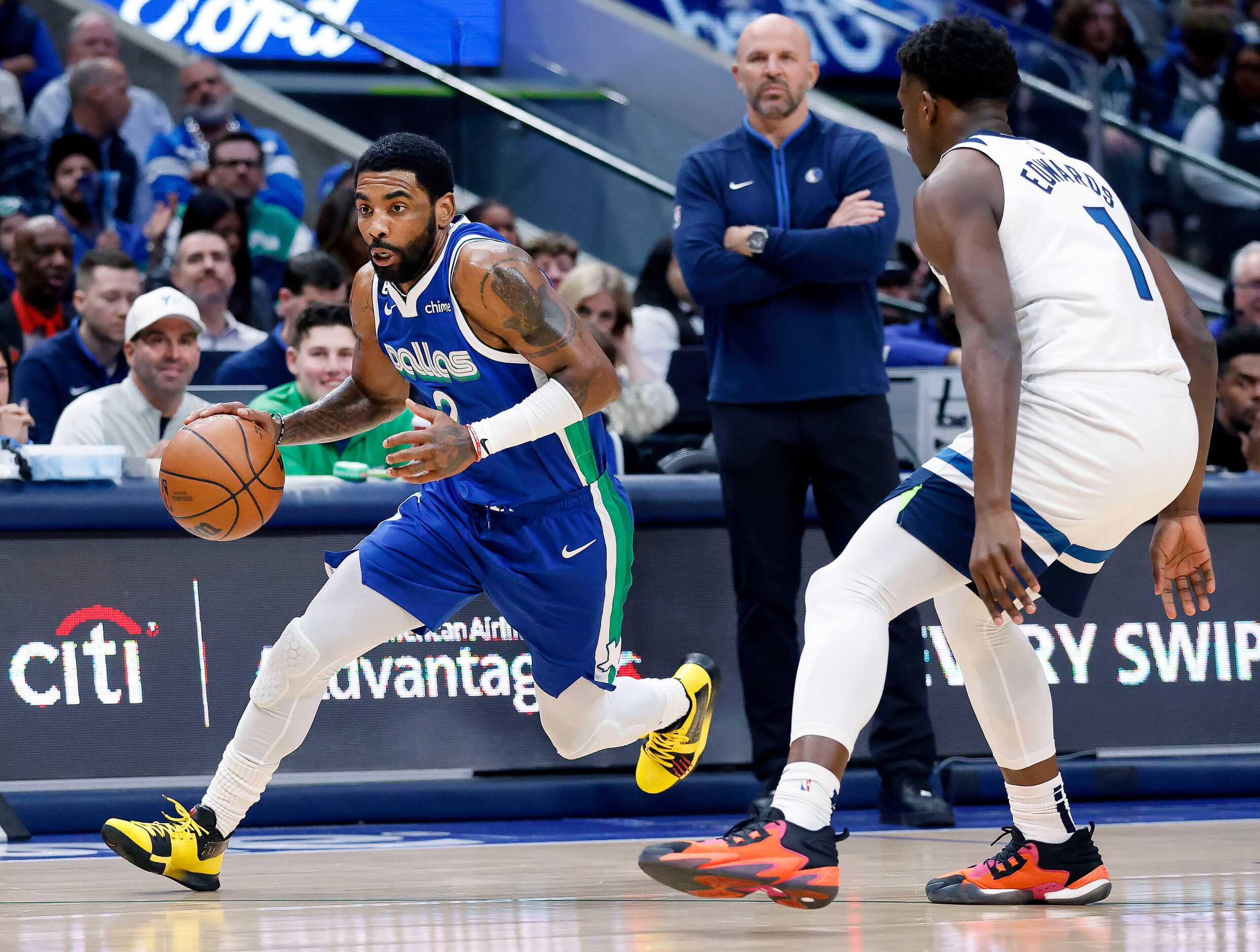 Dallas Mavericks guard Kyrie Irving (2) drives past Minnesota Timberwolves guard Anthony...