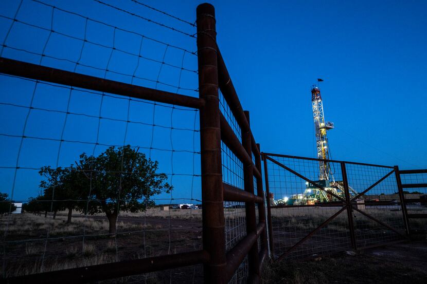  Workers extracting oil from oil wells in the Permian Basin in Midland, Texas on May 5, 2018. 