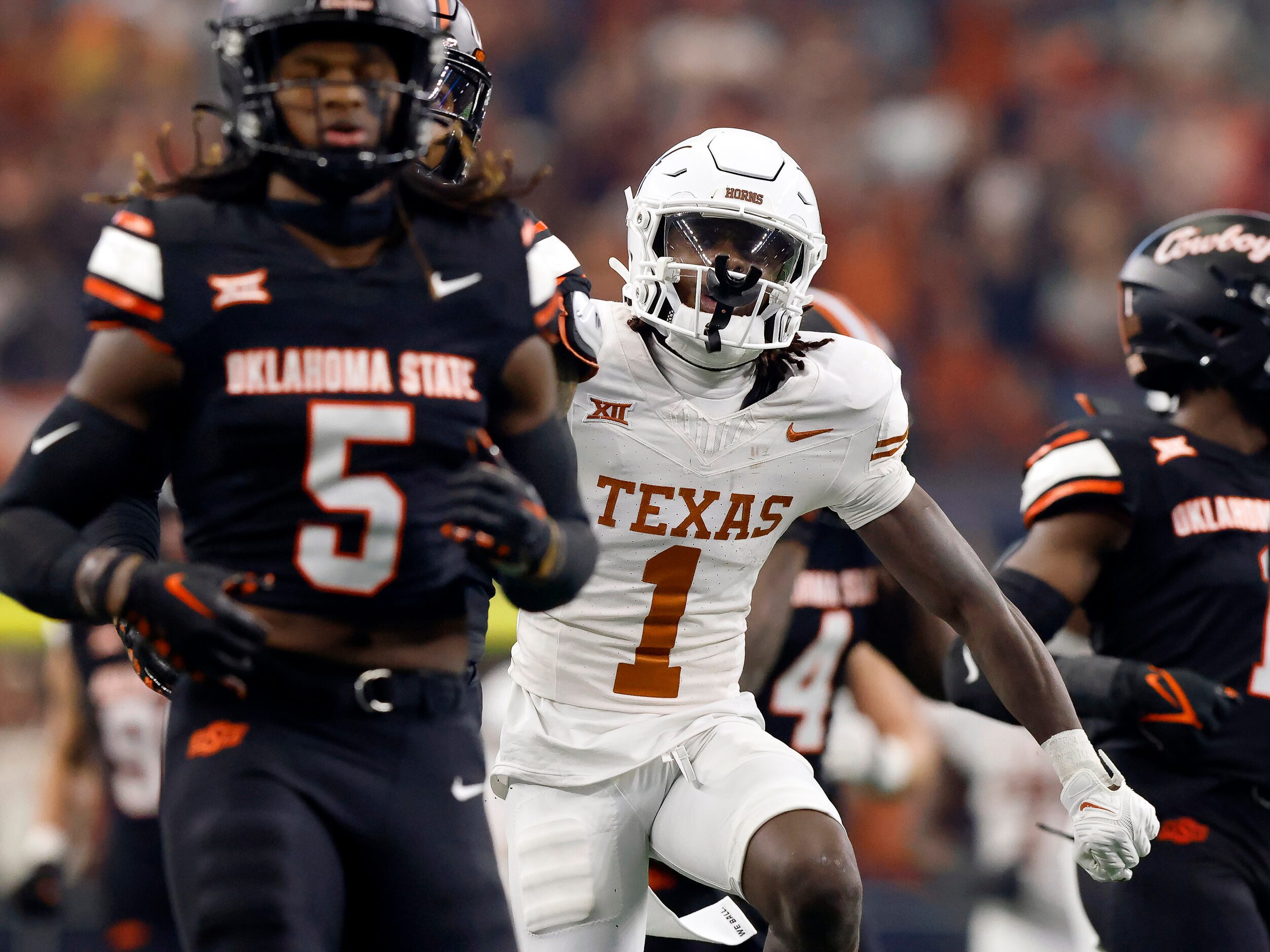 Texas Longhorns wide receiver Xavier Worthy (1) exhualts after his big first quarter catch...