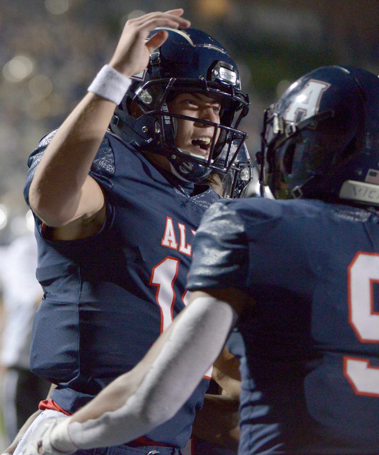 Allen quarterback General Booty celebrate after his touchdown run in the second quarter of a...