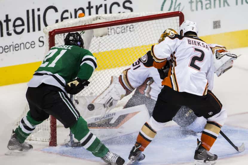Dallas Stars left wing Antoine Roussel (21) scores the game-winning goal during the third...