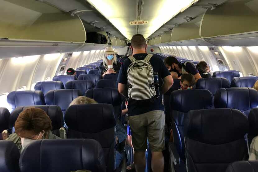 Passengers board a Southwest Airlines flight in Seatac, Wash., bound for Denver on Aug. 16,...