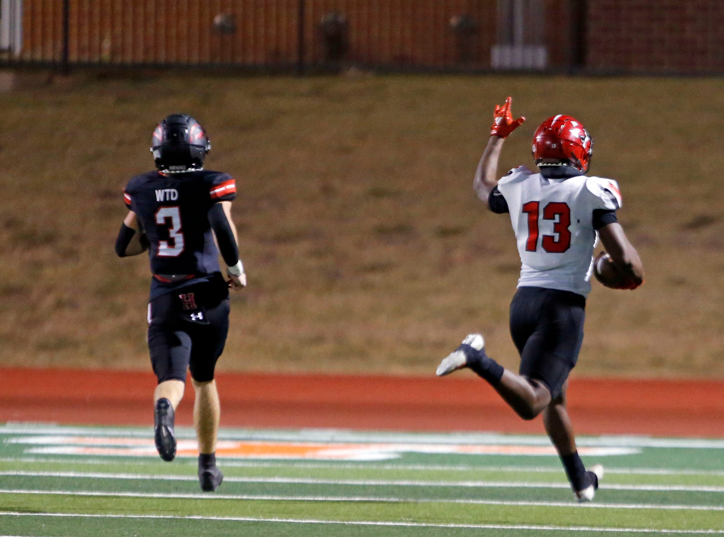 Mesquite Horn defender Armstrong Nnodim (13, right) signals his “Pick Six” score, as...