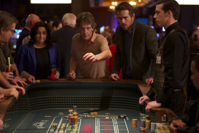 Ryan Reynolds (right) and Ben Mendelsohn in a scene from "Mississippi Grind" 
