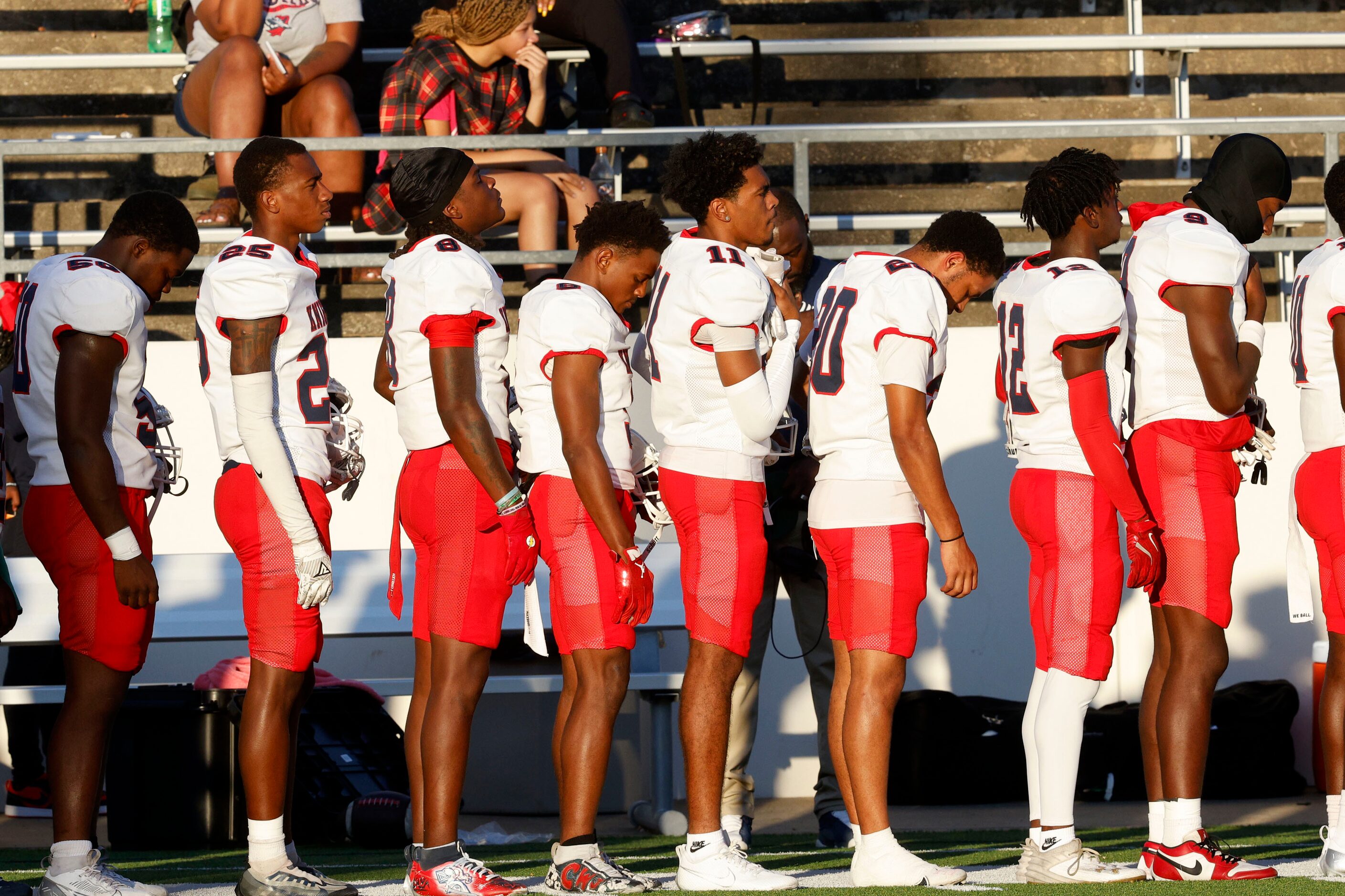 Kimball players take a moment of silence for Kimball JV football player David Washington,...