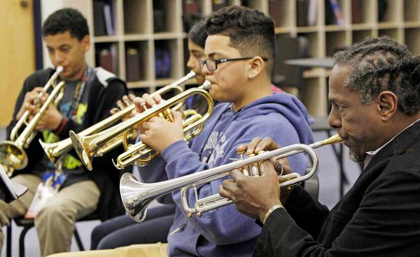 
Jones plays along with his students. Some students will perform at the Trumpet Wars in Fort...