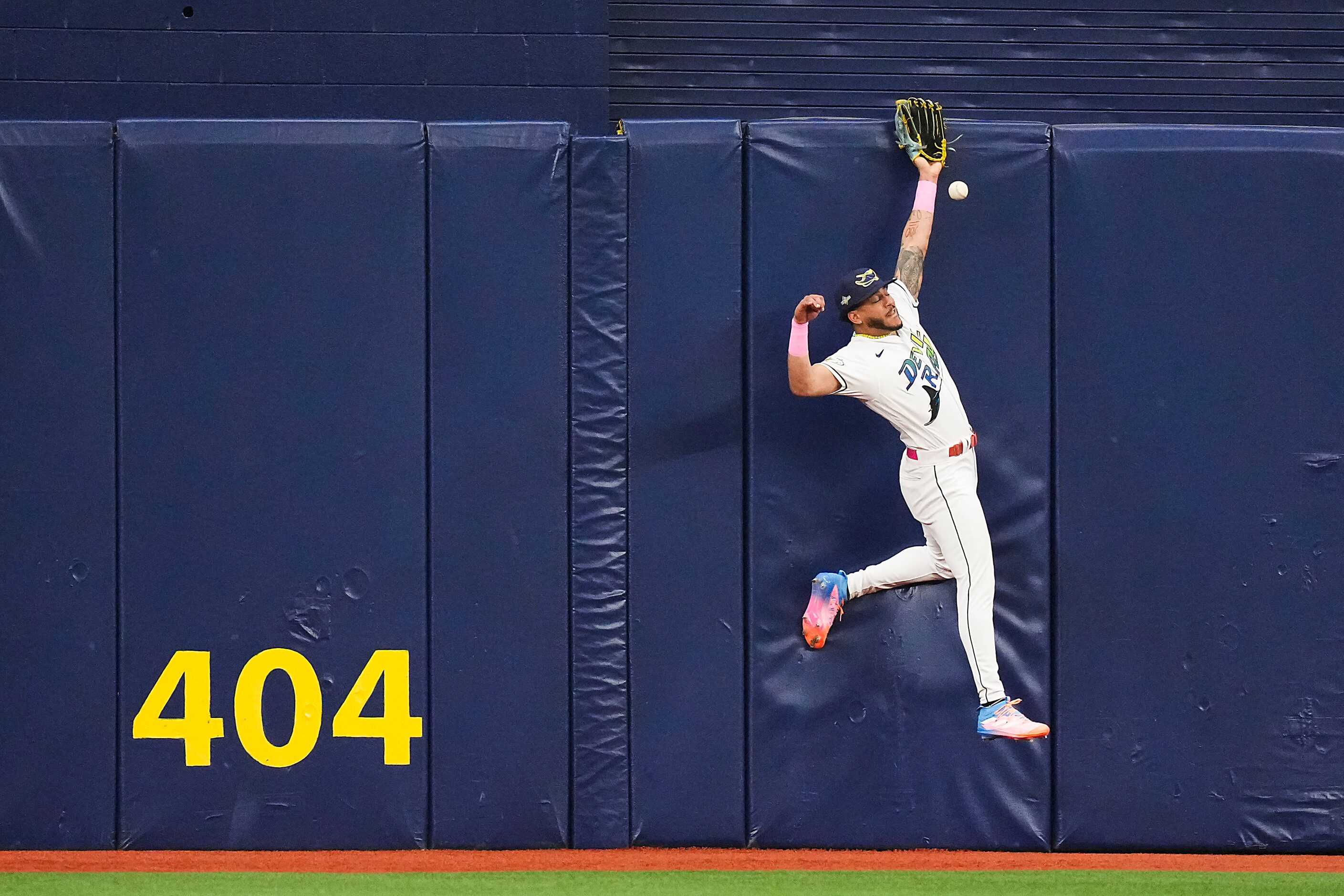 Tampa Bay Rays center fielder Jose Siri can’t make a catch on a leadoff double off the bat...