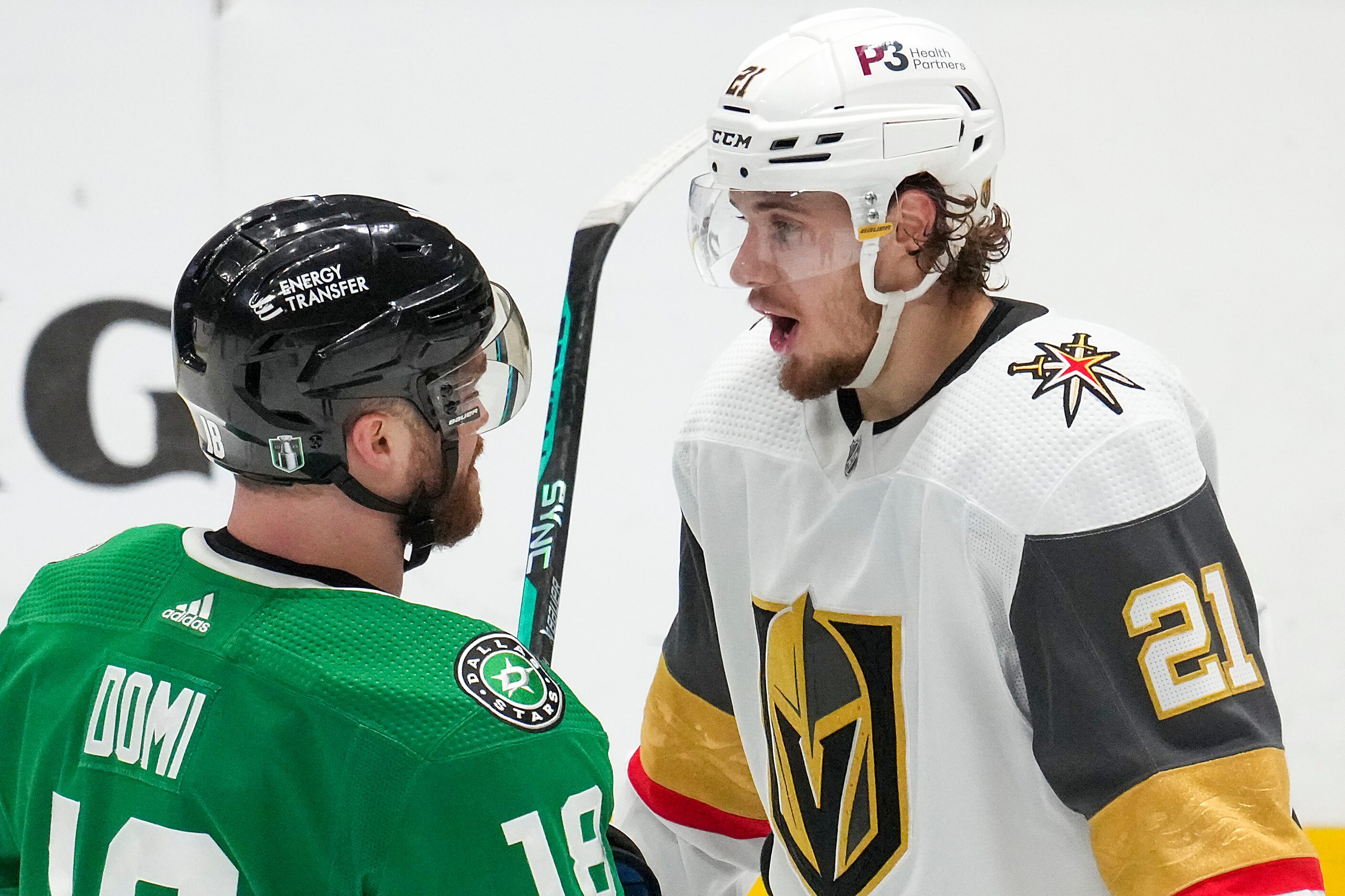 Dallas Stars center Max Domi (18) has words with Vegas Golden Knights center Brett Howden...