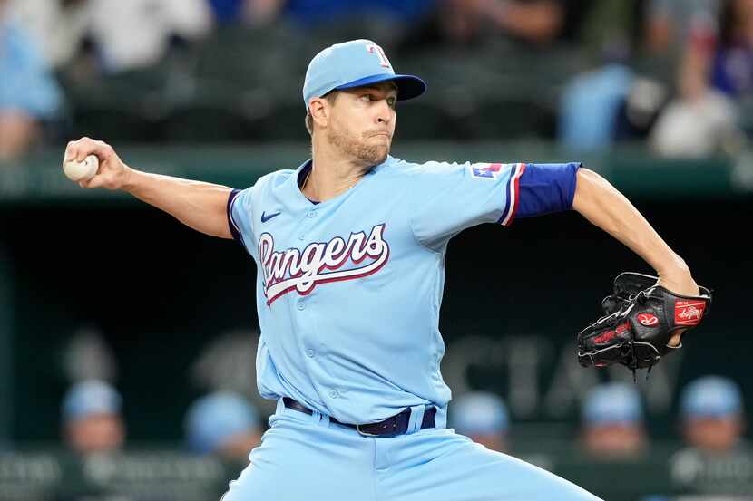 Texas Rangers starting pitcher Jacob deGrom delivers a pitch to the Oakland Athletics during...