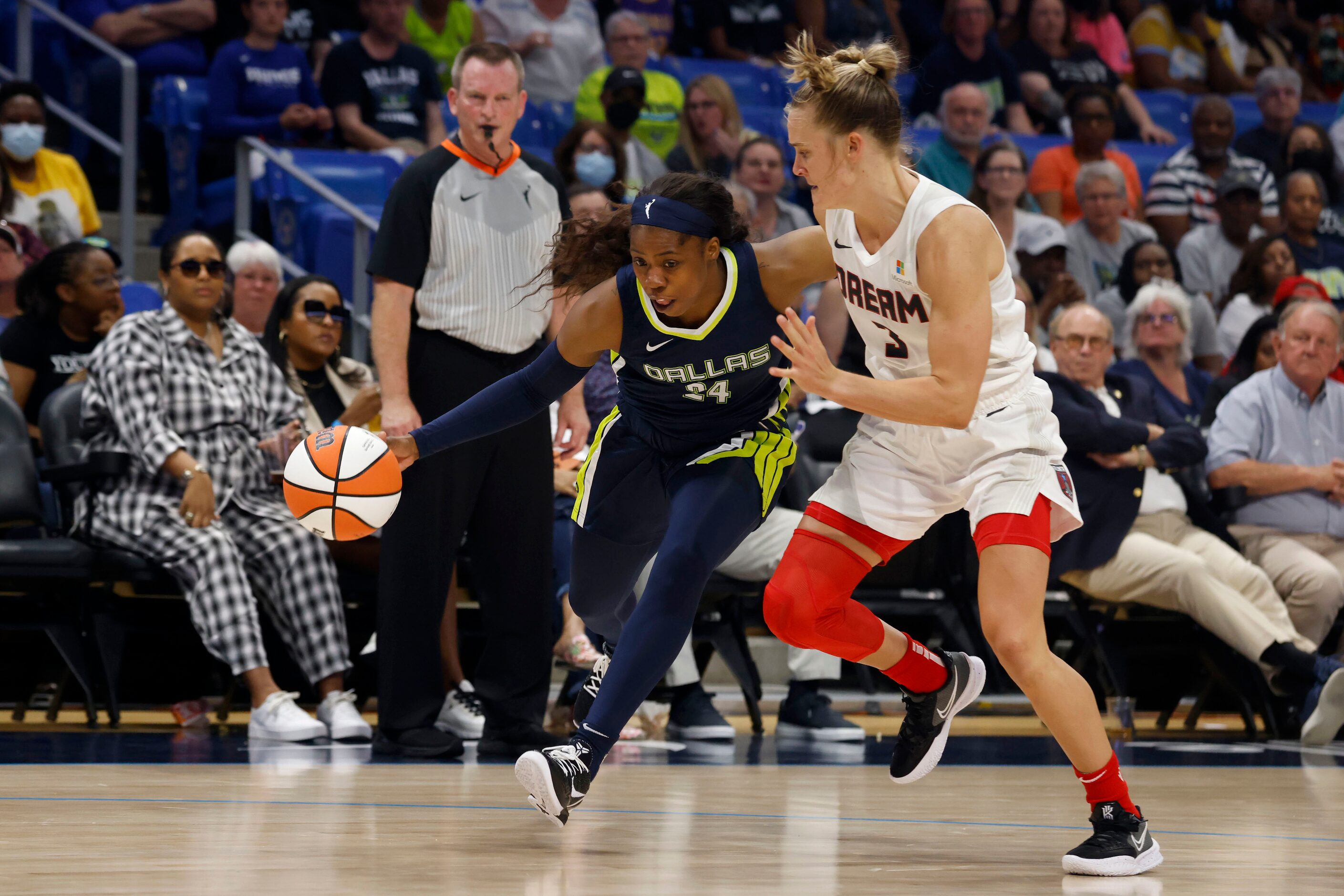 Dallas Wings guard Arike Ogunbowale (24) tries to get past Atlanta Dream guard Chennedy...